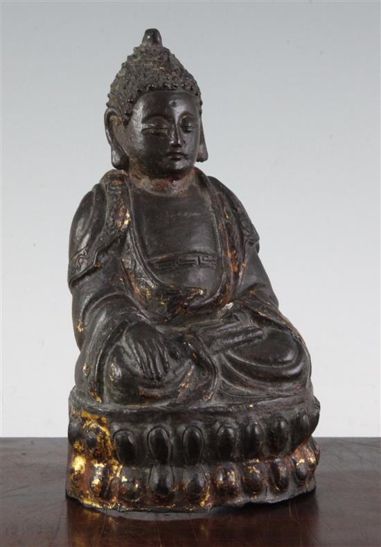 A Chinese gilt lacquered bronze seated figure of Buddha Shakyamuni, 17th century, 22cm